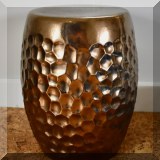 F21. One of two bronze colored garden stools. 
